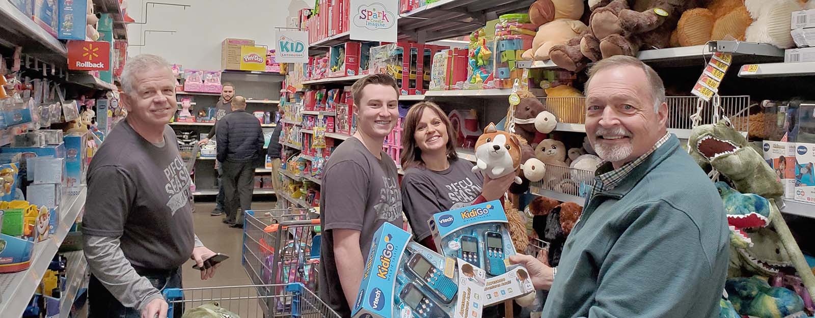 People smiling in toy aisle