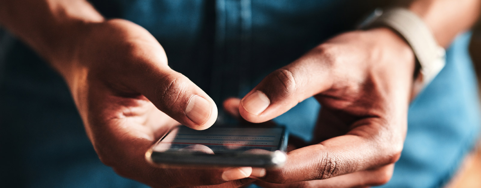 Person holding smart phone