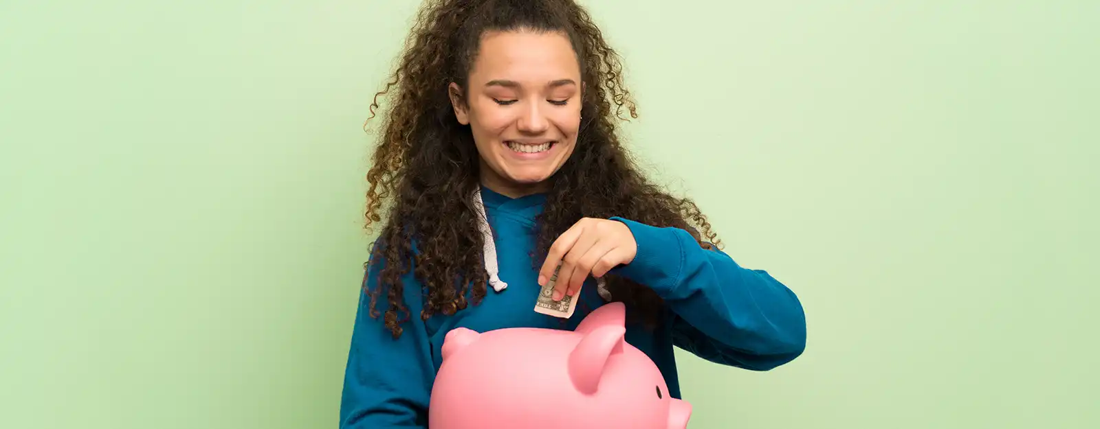 woman holding piggy bank