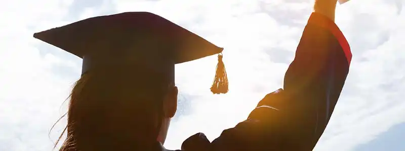 Graduate image linking to https://p1fcu-uat.banno.com/stuff-the-buss