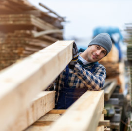 Man lifting timber