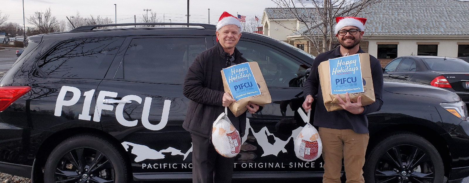 People smiling while holding P1FCU bags for Turkey Delivery