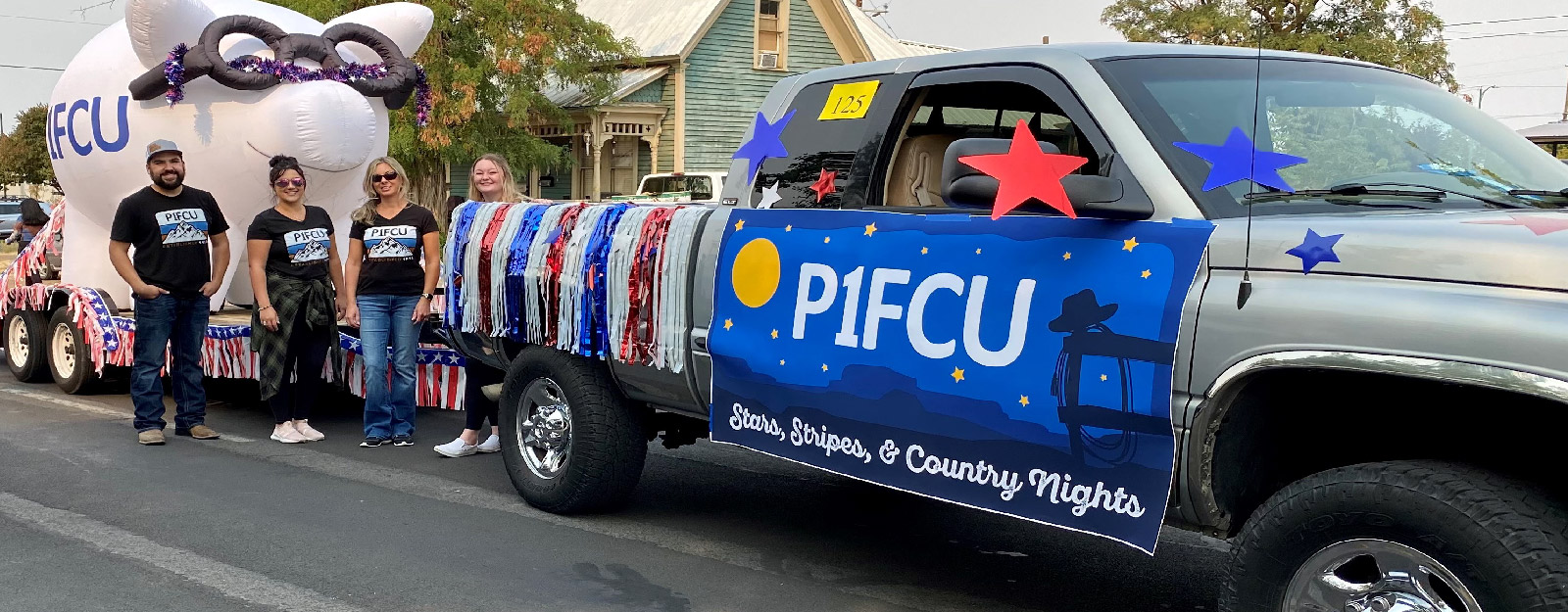 P1FCU float and truck in parade